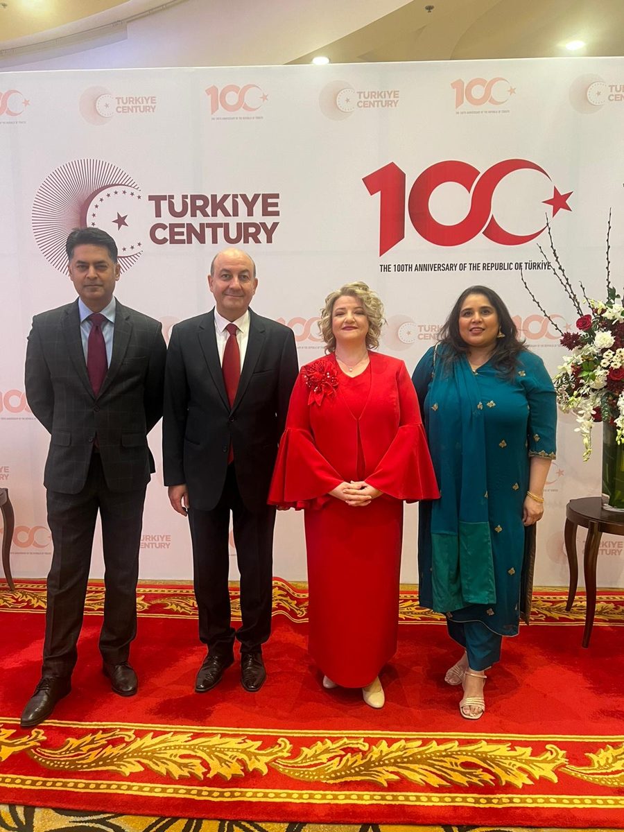 Shahmeen Islam with guests in front of a Türkiye Century backdrop