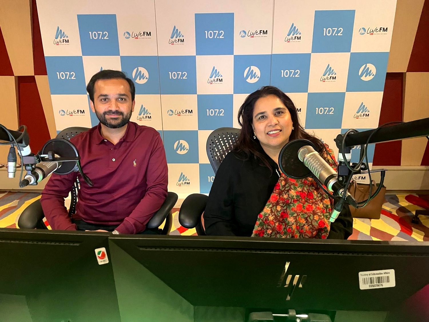 Shahmeen Islam with a guest at the studio microphones