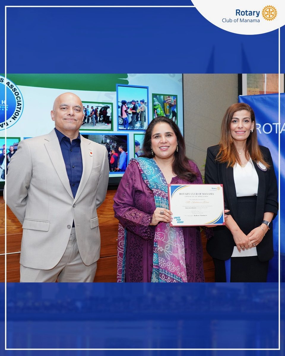 Shahmeen Islam receiving a certificate at the Rotary Club of Manama
